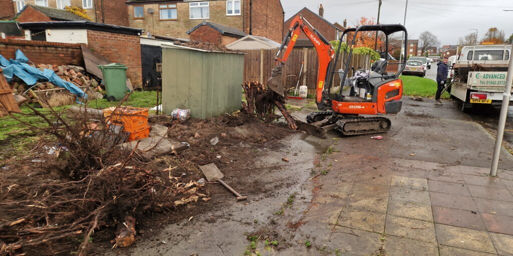 Old Fence and large shrub removal using mini digger